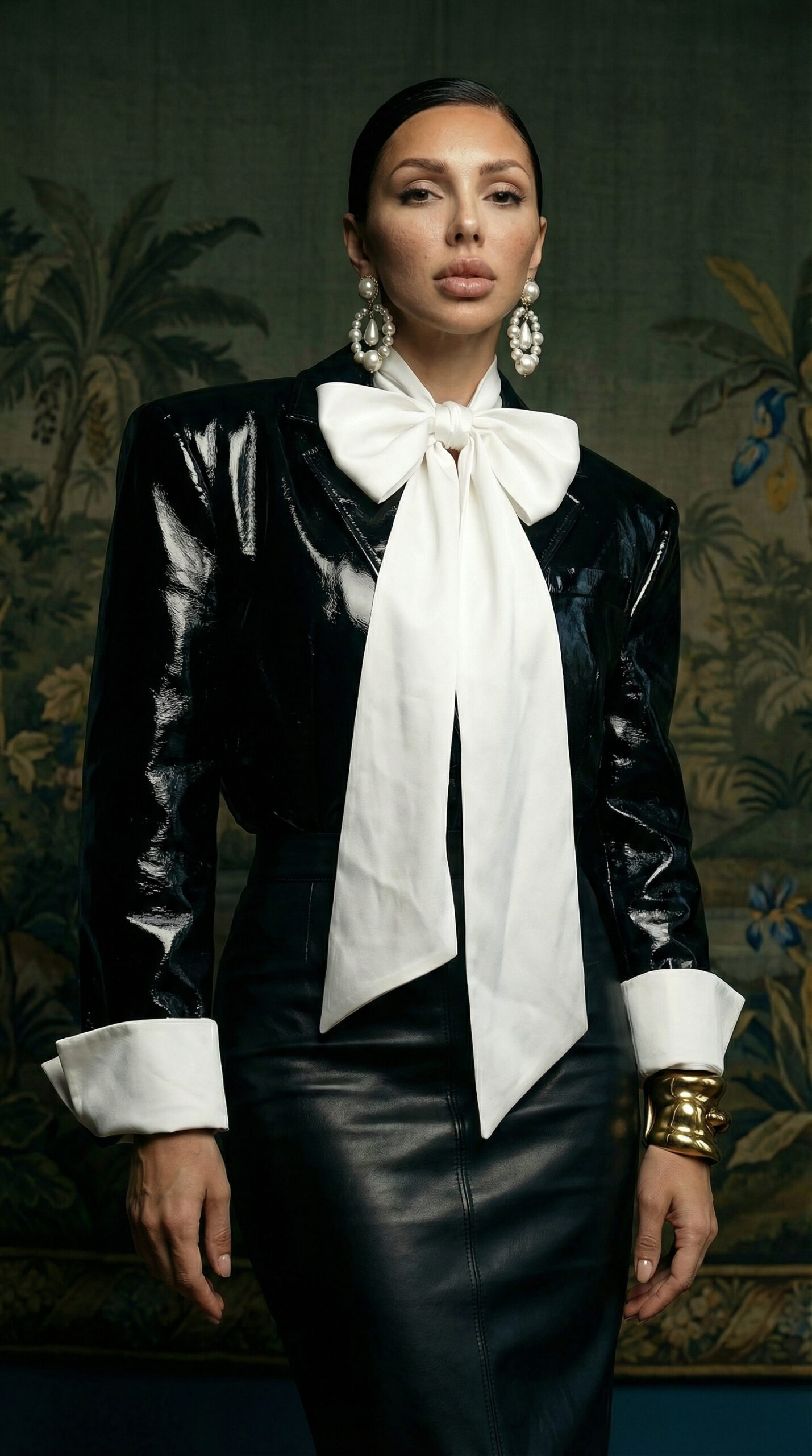 A luxury fashion editorial image featuring elegant leather and bow couture look and vintage interior styling